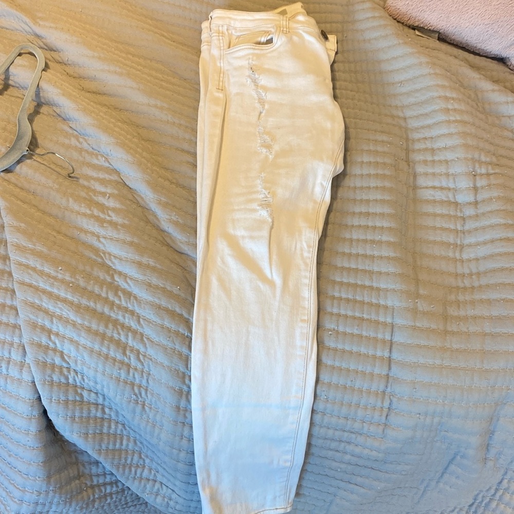 Distressed white skinny jeans